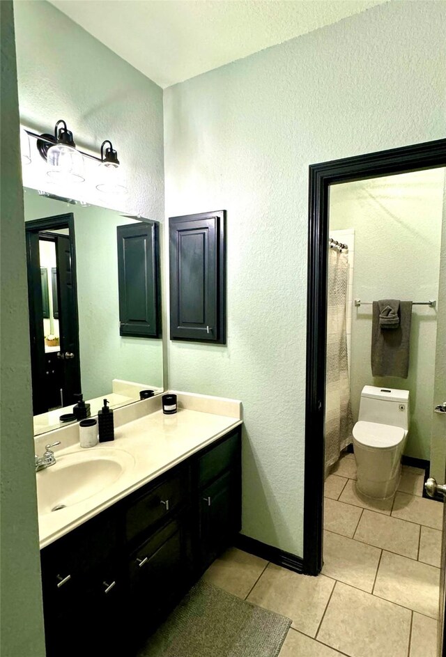 31 Hope Farm Rd, Missouri City, TX 77459 - full bath featuring vanity, tile patterned flooring, toilet, and a textured wall