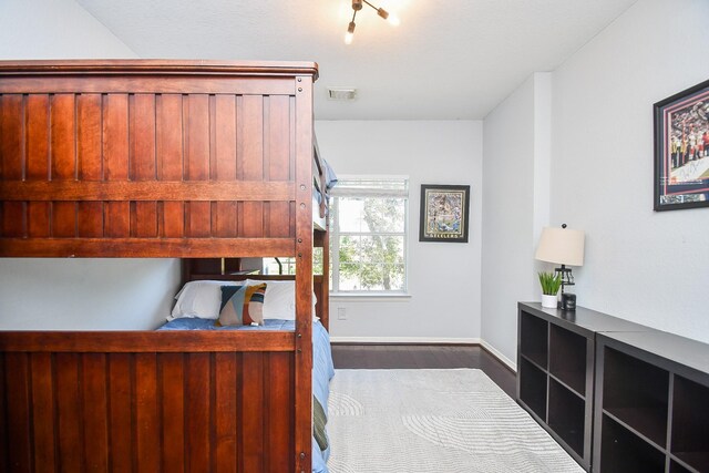 31 Hope Farm Rd, Missouri City, TX 77459 - bedroom featuring dark wood-style flooring and baseboards