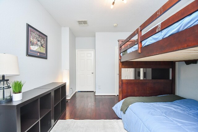 31 Hope Farm Rd, Missouri City, TX 77459 - bedroom with dark wood-style floors and baseboards