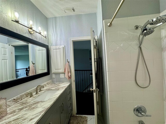 31 Hope Farm Rd, Missouri City, TX 77459 - full bath featuring vanity, tub / shower combination, a textured ceiling, and a textured wall