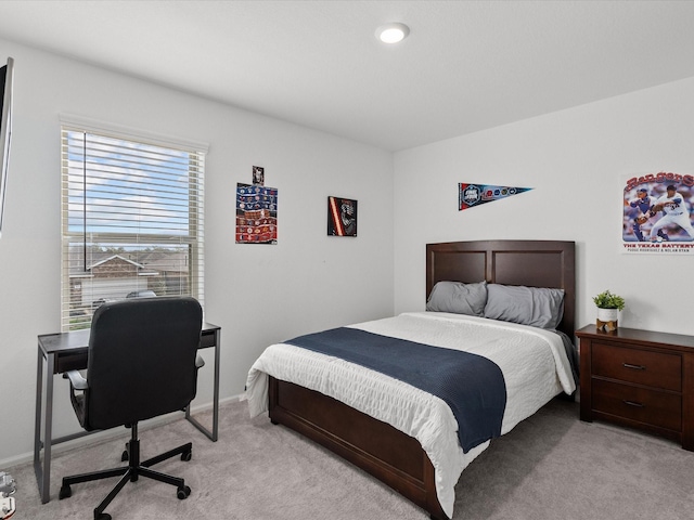 512 Maple Bnd, La Marque, TX 77568 - bedroom featuring light colored carpet, an office area, and baseboards