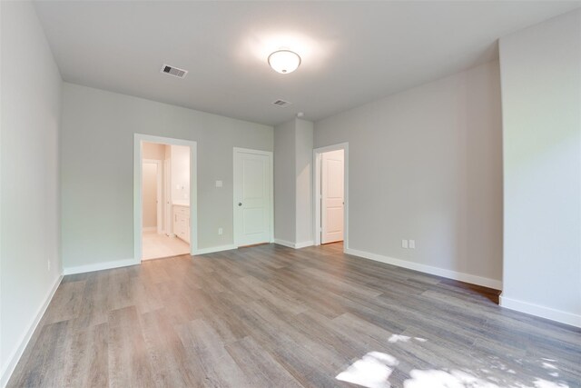 6615 Ezzard Charles Ln, Houston, TX 77091 - empty room featuring wood finished floors and baseboards