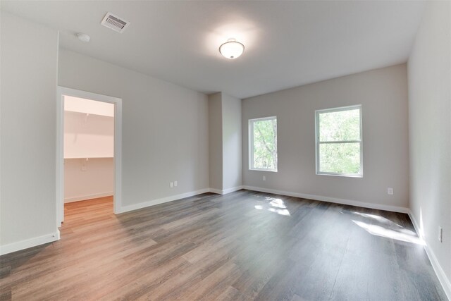 6615 Ezzard Charles Ln, Houston, TX 77091 - spare room featuring wood finished floors and baseboards