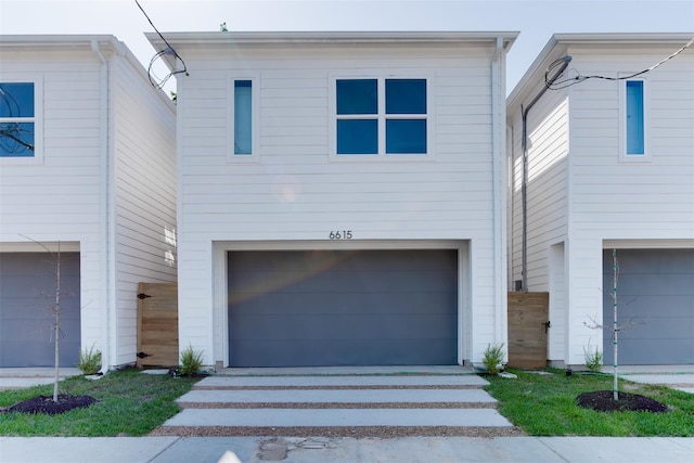 6615 Ezzard Charles Ln, Houston, TX 77091 - view of front of house featuring an attached garage