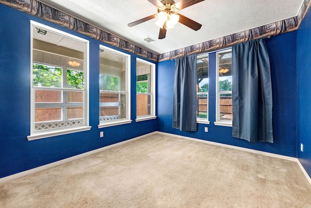 20535 Spring Bluff Ln, Spring, TX 77388 - carpeted empty room with baseboards, a ceiling fan, and a textured ceiling