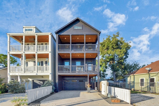 928 Dunbar St, Houston, TX 77009 - view of front of house with a garage, a balcony, and driveway