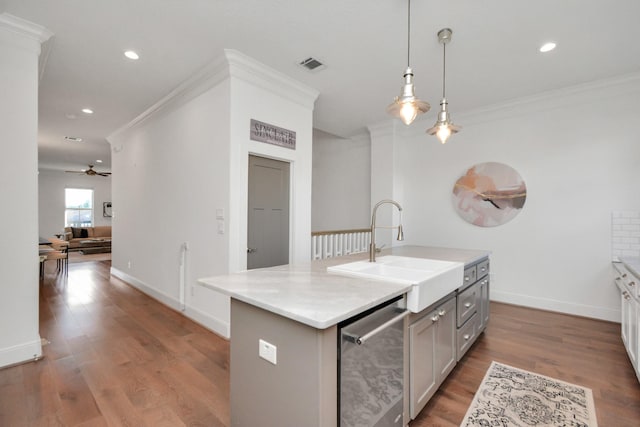 928 Dunbar St, Houston, TX 77009 - kitchen with a sink, stainless steel dishwasher, crown molding, ceiling fan, and wood finished floors