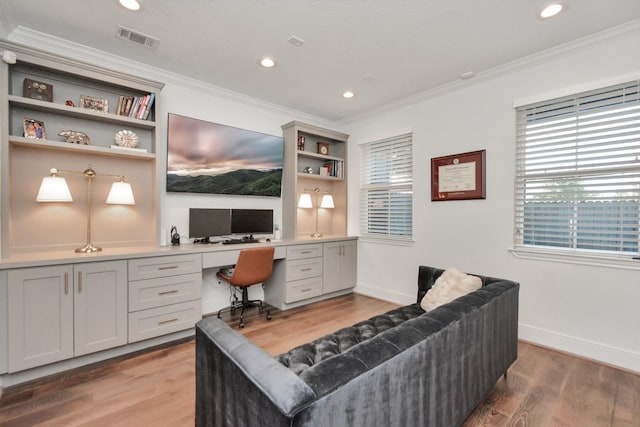928 Dunbar St, Houston, TX 77009 - office area with built in desk, ornamental molding, light wood finished floors, recessed lighting, and baseboards