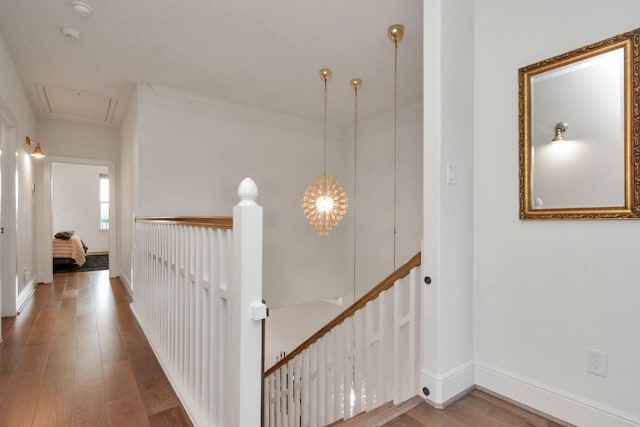 928 Dunbar St, Houston, TX 77009 - corridor featuring an upstairs landing, wood finished floors, baseboards, and attic access