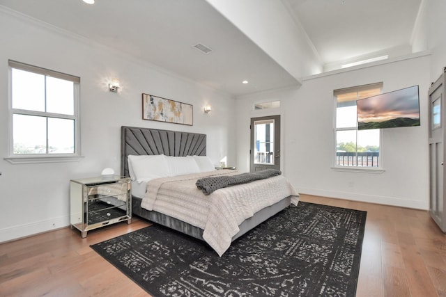 928 Dunbar St, Houston, TX 77009 - bedroom with ornamental molding, multiple windows, wood finished floors, baseboards, and recessed lighting