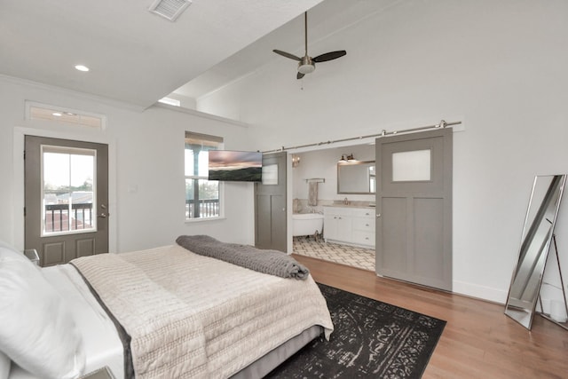 928 Dunbar St, Houston, TX 77009 - bedroom featuring wood finished floors, connected bathroom, recessed lighting, and ceiling fan