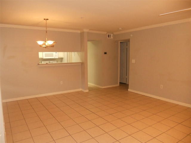501 W 26th St Unit 208, Austin, TX 78705 - spare room featuring a chandelier, crown molding, and light tile patterned floors