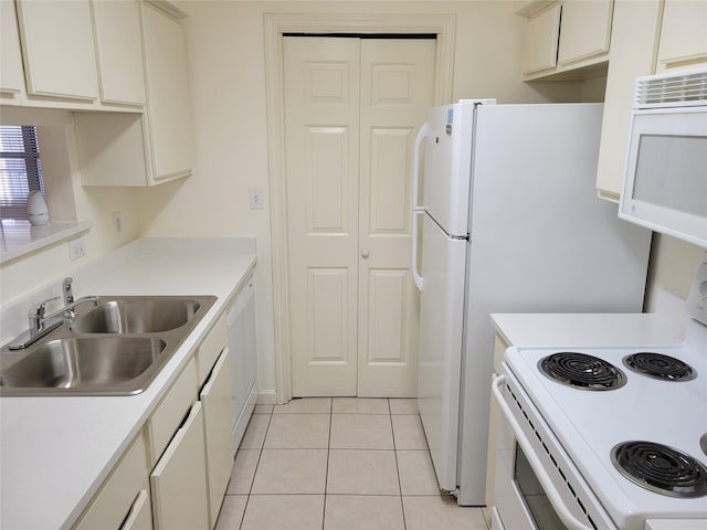 501 W 26th St Unit 208, Austin, TX 78705 - kitchen with white appliances, light countertops, and light tile patterned floors