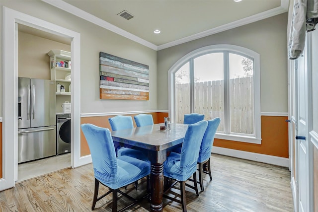 1418 Du Barry Ln, Houston, TX 77018 - dining space with washer / clothes dryer, light wood finished floors, crown molding, and recessed lighting