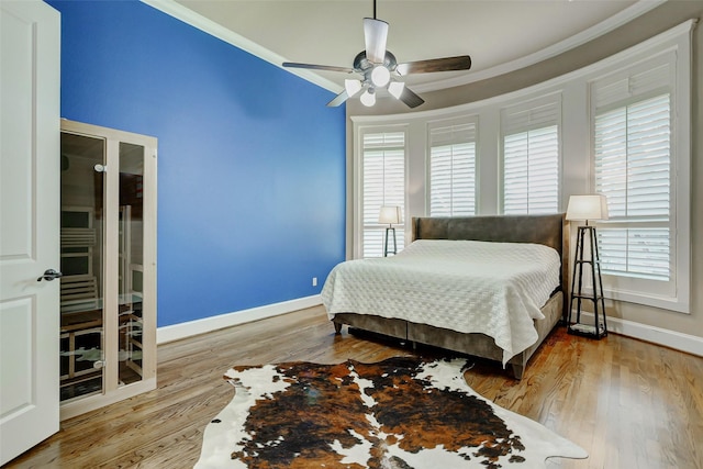 1418 Du Barry Ln, Houston, TX 77018 - bedroom with ornamental molding, wood finished floors, and ceiling fan
