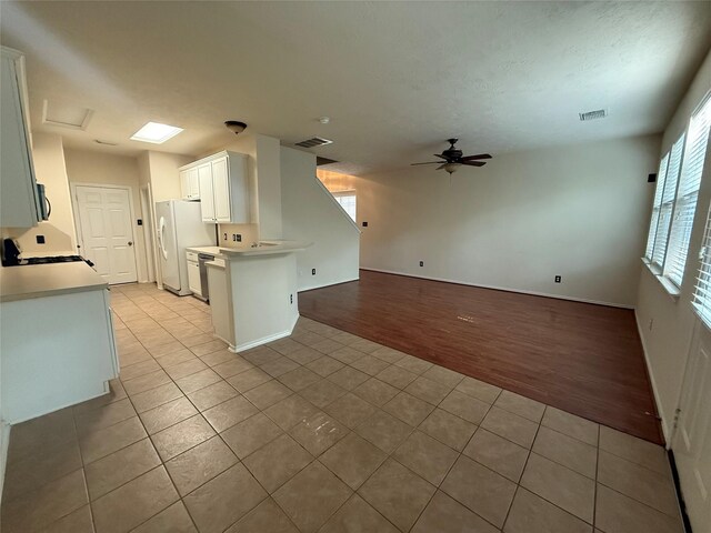 226 W Stedhill Loop, Conroe, TX 77384 - kitchen featuring freestanding refrigerator, light tile patterned floors, a ceiling fan, open floor plan, and light countertops