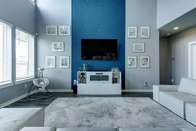 4910 Magnolia Springs Dr, Pearland, TX 77584 - living room with baseboards and wood finished floors