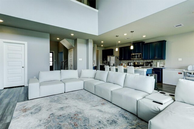4910 Magnolia Springs Dr, Pearland, TX 77584 - living area featuring dark wood-style floors and recessed lighting