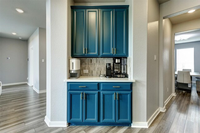 4910 Magnolia Springs Dr, Pearland, TX 77584 - bar with light wood-style flooring, baseboards, decorative backsplash, and recessed lighting