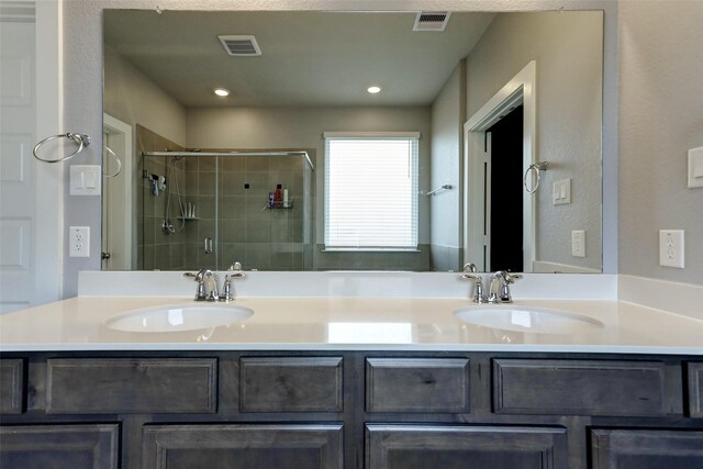 4910 Magnolia Springs Dr, Pearland, TX 77584 - bathroom featuring a shower stall, double vanity, and recessed lighting