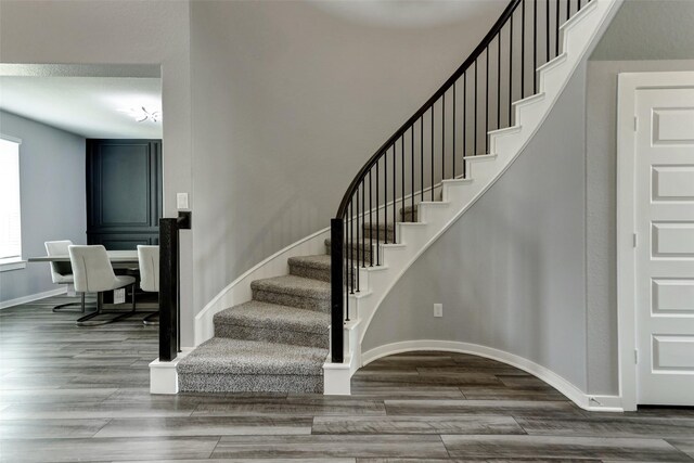 4910 Magnolia Springs Dr, Pearland, TX 77584 - stairway with wood finished floors and baseboards