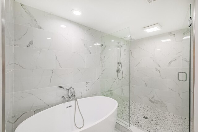2322 Steel St Unit 19, Houston, TX 77098 - bathroom with a marble finish shower, a freestanding tub, and recessed lighting