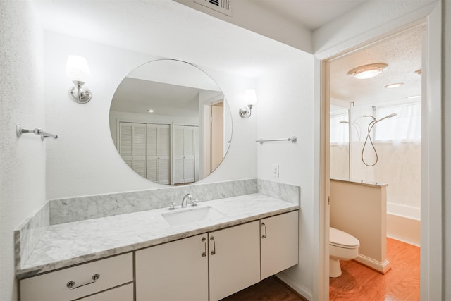 2322 Steel St Unit 19, Houston, TX 77098 - full bath with vanity, toilet, wood finished floors, and shower / tub combination