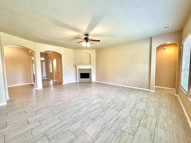 2115 Mooncrest Dr, Houston, TX 77089 - unfurnished living room featuring a ceiling fan, wood finish floors, baseboards, and a fireplace