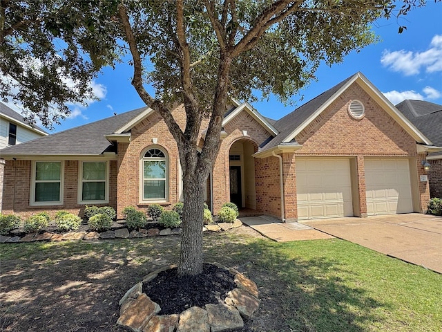 2115 Mooncrest Dr, Houston, TX 77089 - ranch-style home featuring a garage, brick siding, driveway, roof with shingles, and a front lawn