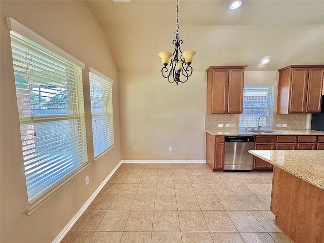 2115 Mooncrest Dr, Houston, TX 77089 - kitchen featuring dishwasher, a sink, tasteful backsplash, brown cabinetry, and a chandelier