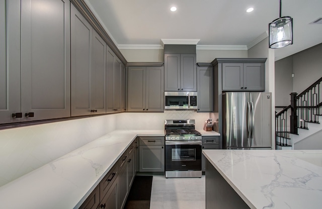 1708 Capron St Unit A, Houston, TX 77020 - kitchen with stainless steel appliances, gray cabinetry, light stone countertops, tasteful backsplash, and ornamental molding