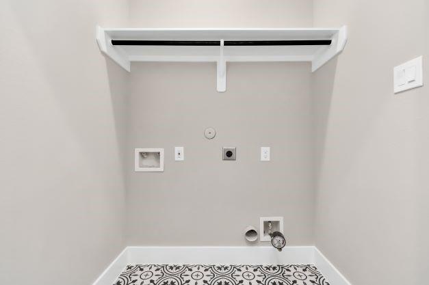 1708 Capron St Unit A, Houston, TX 77020 - laundry room featuring gas dryer hookup, hookup for an electric dryer, hookup for a washing machine, and baseboards