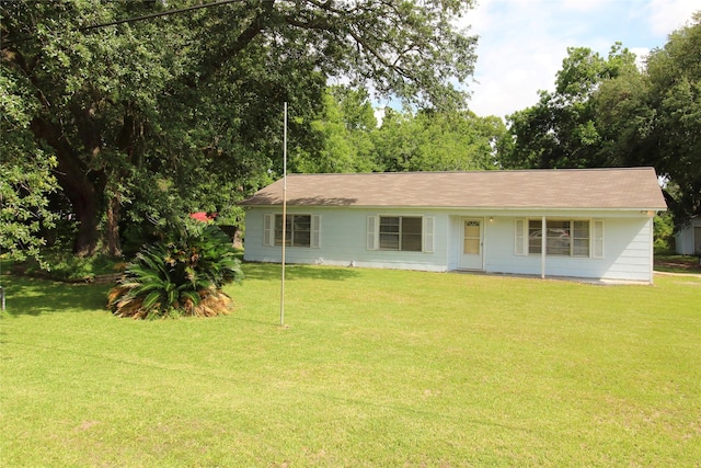 916 Cedar Bayou Rd, Baytown, TX 77520 - ranch-style house with a front yard