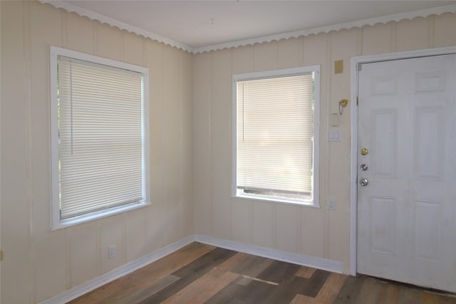 916 Cedar Bayou Rd, Baytown, TX 77520 - entryway featuring dark wood-type flooring, baseboards, and a decorative wall