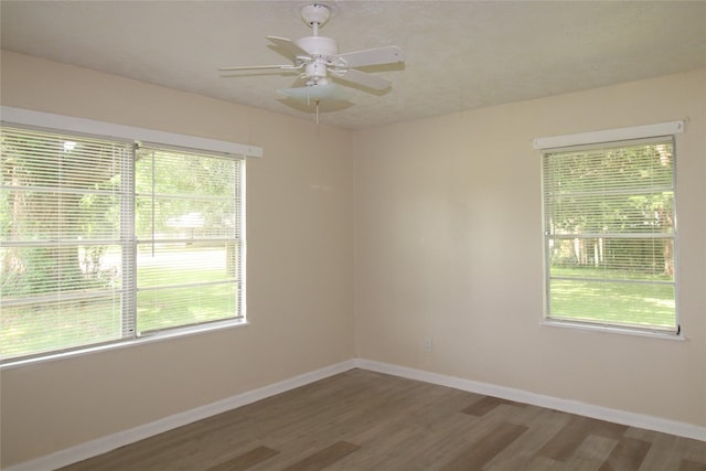 916 Cedar Bayou Rd, Baytown, TX 77520 - empty room with wood finished floors, baseboards, and ceiling fan