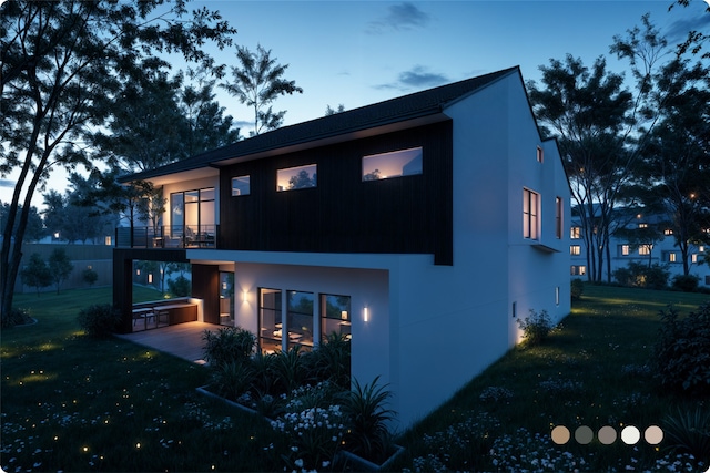 1407 Indiana St, Houston, TX 77006 - back of house featuring a lawn, a balcony, a patio, and stucco siding