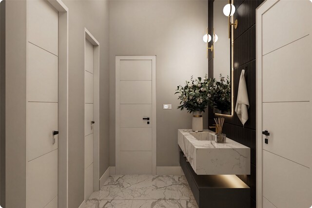 1407 Indiana St, Houston, TX 77006 - bathroom featuring marble finish flooring, vanity, and baseboards
