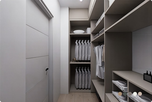 1407 Indiana St, Houston, TX 77006 - walk in closet with light wood-style floors