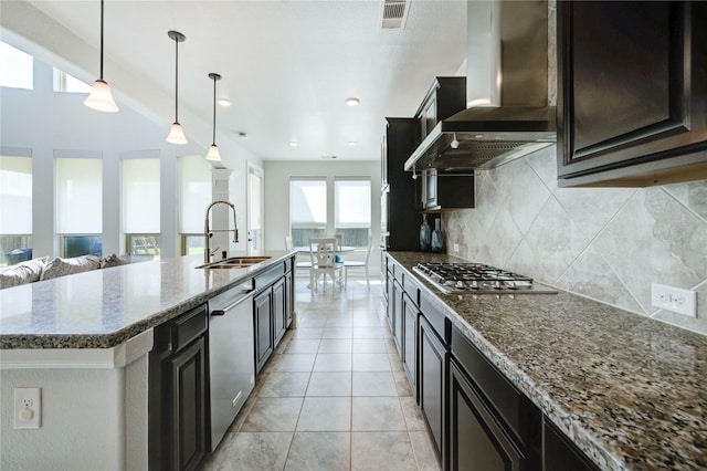 1103 River Delta Ln, Rosenberg, TX 77469 - kitchen with a sink, wall chimney exhaust hood, appliances with stainless steel finishes, decorative backsplash, and open floor plan