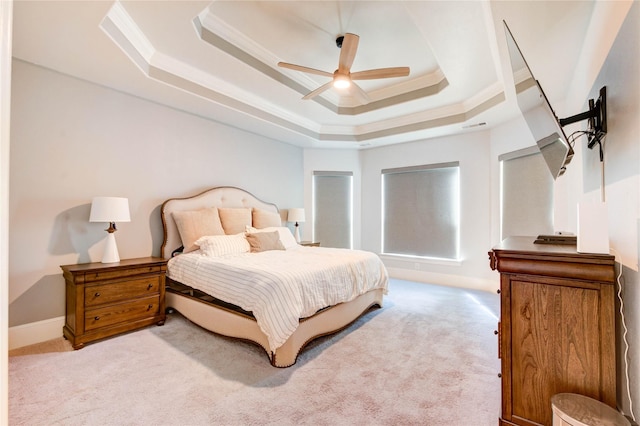 1103 River Delta Ln, Rosenberg, TX 77469 - bedroom featuring a raised ceiling, light carpet, ornamental molding, ceiling fan, and baseboards