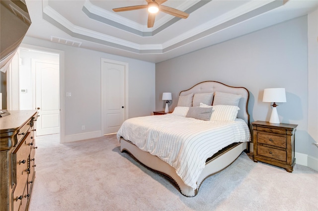 1103 River Delta Ln, Rosenberg, TX 77469 - bedroom with a raised ceiling, light carpet, ornamental molding, a ceiling fan, and baseboards