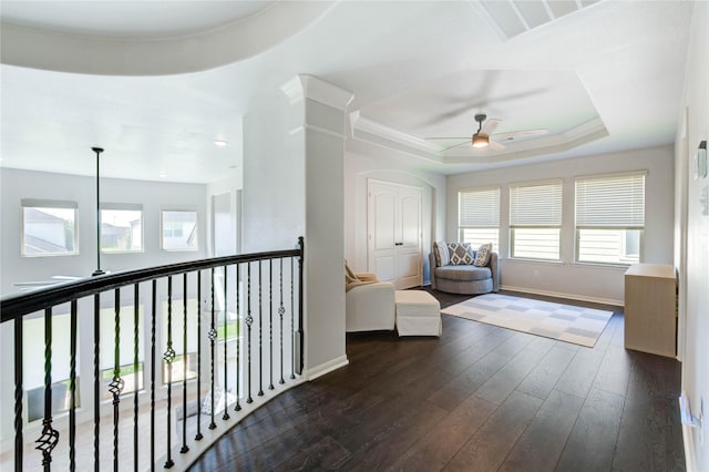 1103 River Delta Ln, Rosenberg, TX 77469 - sitting room featuring a ceiling fan, dark wood-style flooring, baseboards, and a tray ceiling