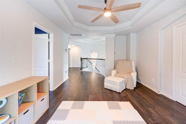 1103 River Delta Ln, Rosenberg, TX 77469 - living area with a tray ceiling, dark wood finished floors, ceiling fan, baseboards, and crown molding