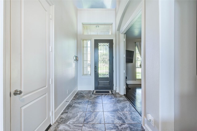 1103 River Delta Ln, Rosenberg, TX 77469 - foyer entrance with baseboards and marble look tiles