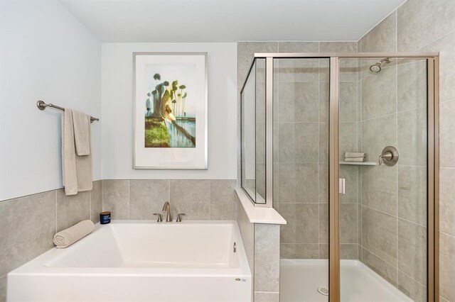 13620 Sorico Bay Dr, Texas City, TX 77568 - bathroom with a stall shower and a bath
