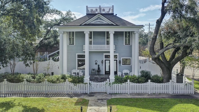 200 Westmoreland St, Houston, TX 77006 - greek revival inspired property featuring a balcony, a fenced front yard, and a porch