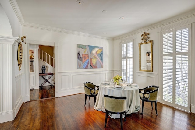 200 Westmoreland St, Houston, TX 77006 - dining area with a decorative wall, wood finished floors, ornamental molding, and a wainscoted wall