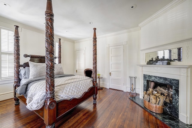 200 Westmoreland St, Houston, TX 77006 - bedroom featuring multiple windows, wood-type flooring, a fireplace, and ornamental molding
