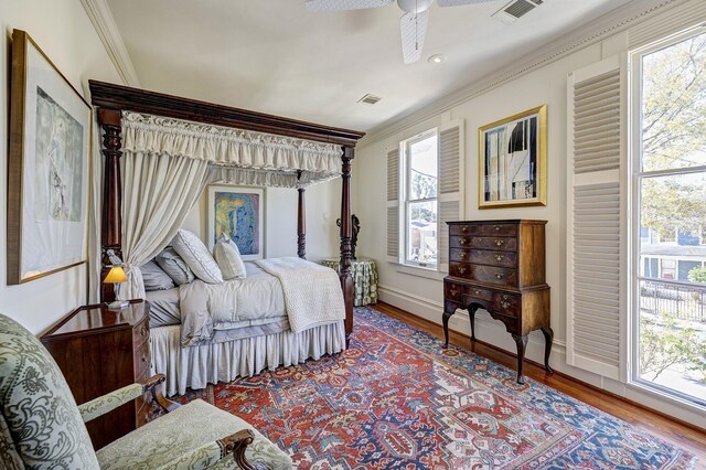 200 Westmoreland St, Houston, TX 77006 - bedroom featuring ornamental molding, wood finished floors, baseboards, and ceiling fan