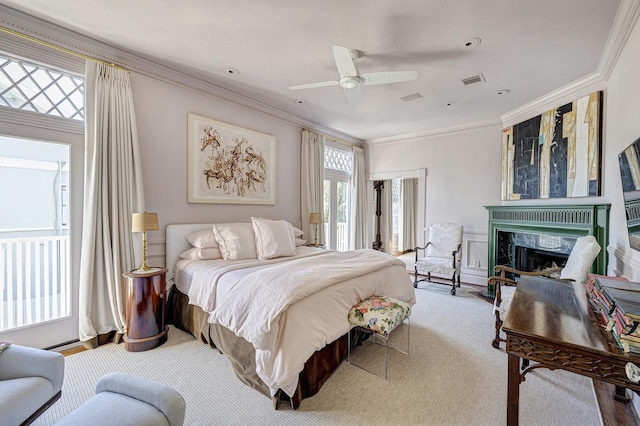 200 Westmoreland St, Houston, TX 77006 - bedroom featuring carpet, ornamental molding, a fireplace, and ceiling fan